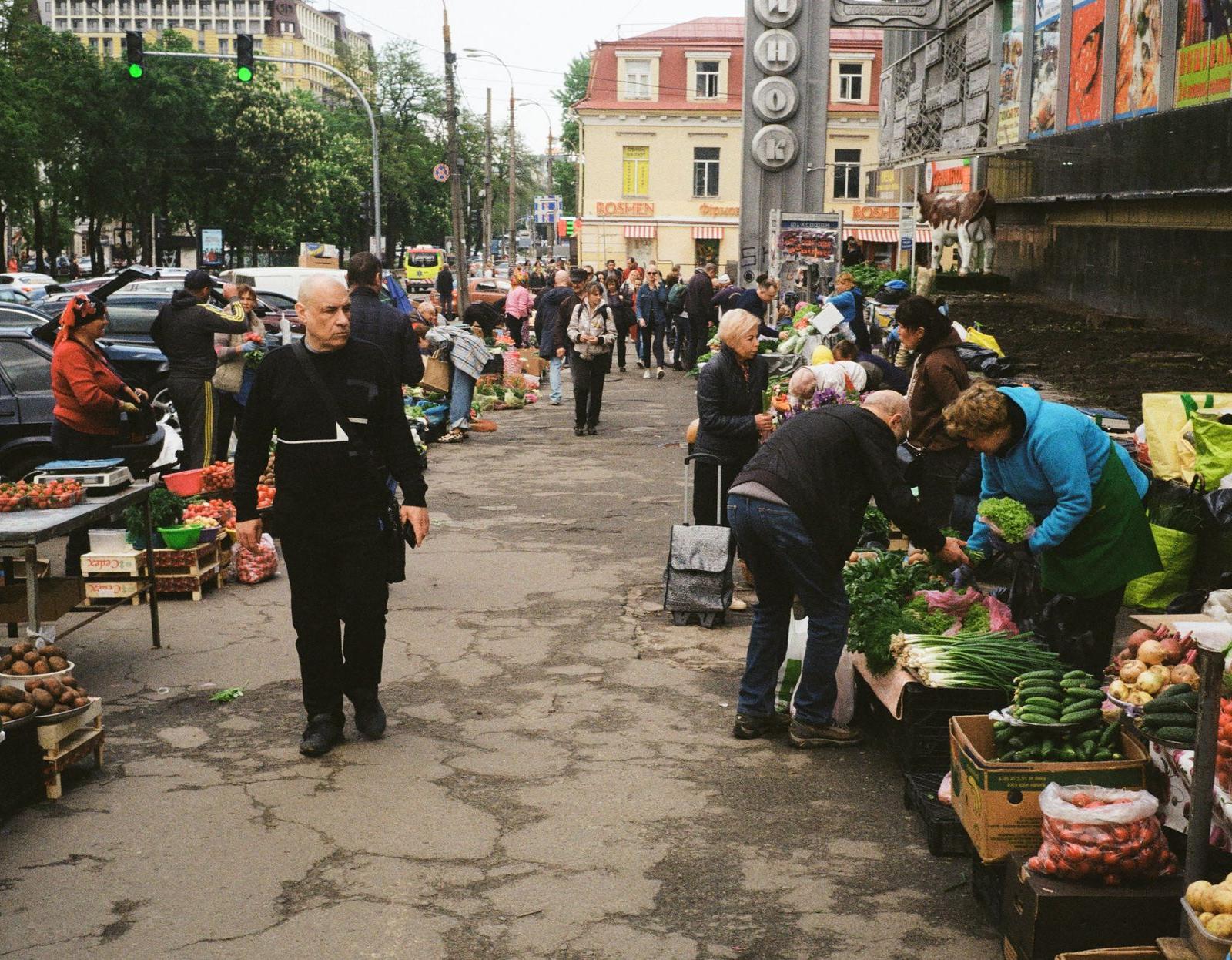 Busy People Buying on the Stalls on the Side of the Street